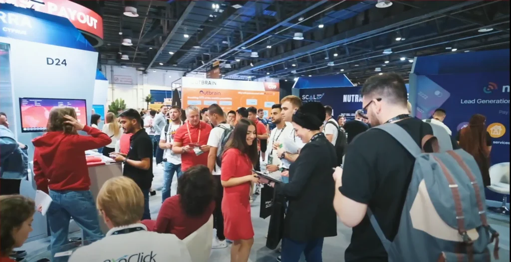 Busy exhibition hall with lots of people