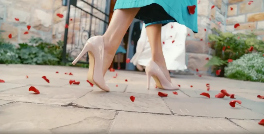 Close up of woman's feet in high heels on a stone floor