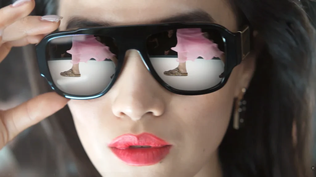 Fashionista adjusts her sunglasses