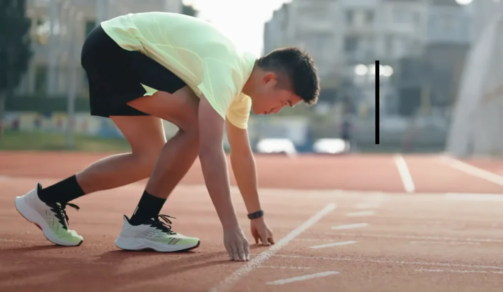 Runner starting on a running track
